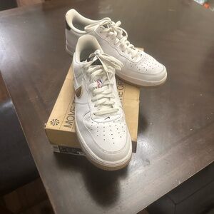 Nike Cream Sneakers with Gold Accent